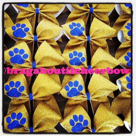 Adelina Gold Glitter Cheer Bow with Royal Blue Paw 