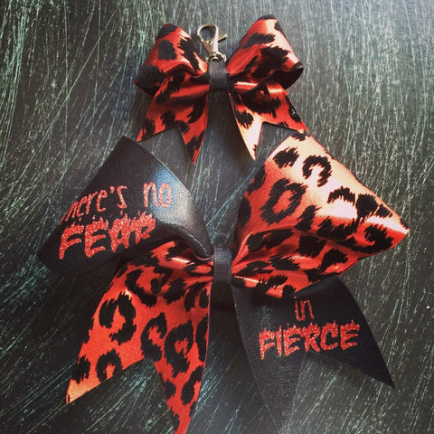 There's no fear in fierce cheer bow in black and red cheetah.